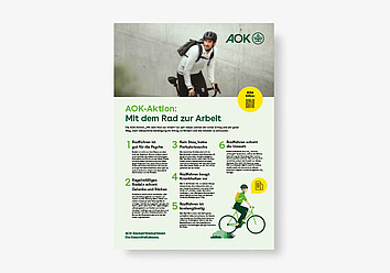 Mit dem Rad zur Arbeit BGF-Poster 02/2026 AOK-Aktion Mit dem Rad zur Arbeit: Mann fährt auf Rennrad.