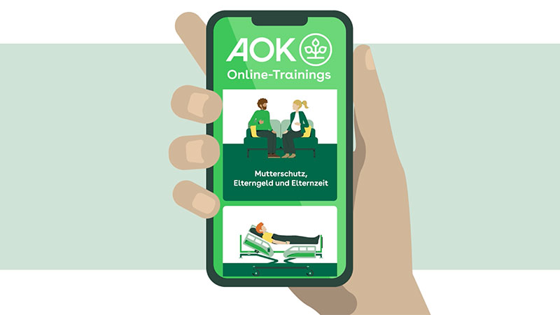 Ein Mobiltelefon zeigt die digitalen Online-Trainings Angebote