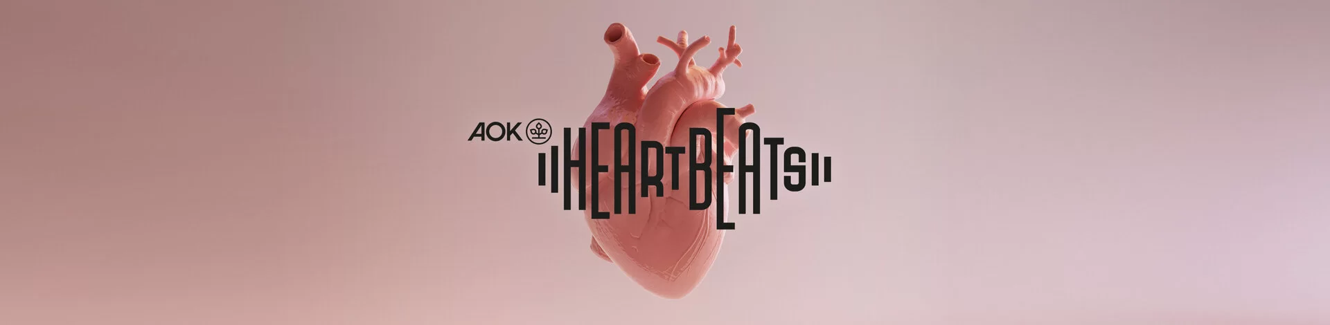 Anatomisch korrektes Modell eines menschlichen Herzens mit der Aufschrift Heartbeats.