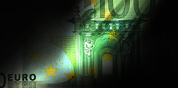 Ein gr&uuml;ner Hundert Euro Schein ist hinter Schatten zu erkennen.