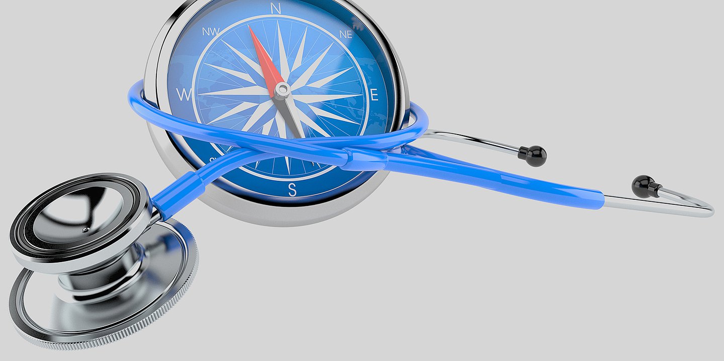 Foto: Illustration eines Stethoskops, das um einen Kompass gewickelt ist.