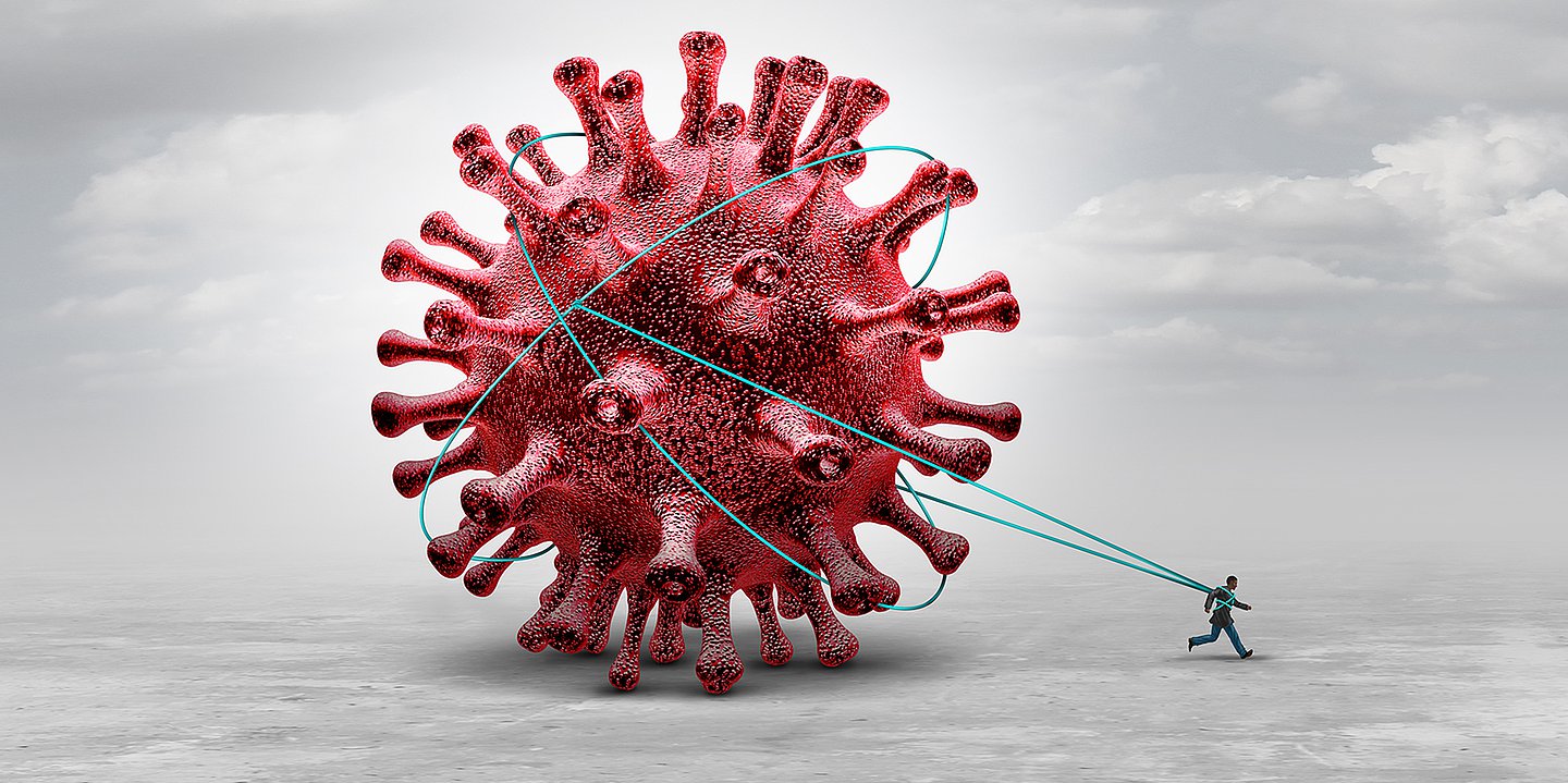 Foto: Illustration einer roten Viruskugel, die von einem Mann gezogen wird.